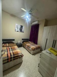 Postel nebo postele na pokoji v ubytování Chaltan Apartments
