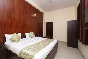 Katil atau katil-katil dalam bilik di OYO Hotel Global Inn