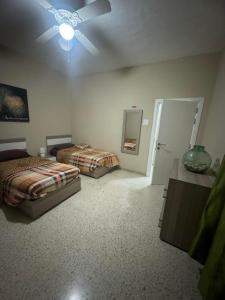 Postel nebo postele na pokoji v ubytování Chaltan Apartments