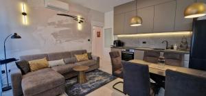 a living room with a couch and a table at La Casa Allegra in Opatija