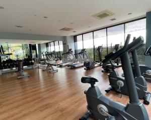 a gym with treadmills and elliptical machines at Comfy 2 bedroom for 6 pax, 3mins walk to Kamalinda in Shah Alam