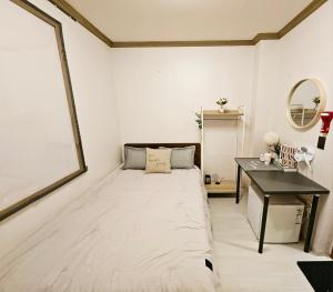 En eller flere senger på et rom på K Highstel Uijeongbu 315