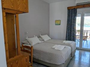 A bed or beds in a room at Kamelia