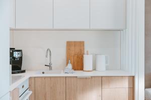 Kuchyň nebo kuchyňský kout v ubytování Nadmorska Apartments ApartView in Łeba by Rent like home + 42 fotografií