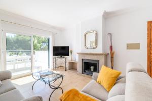 a living room with a couch and a fireplace at Apartamento Minerva in Alcudia