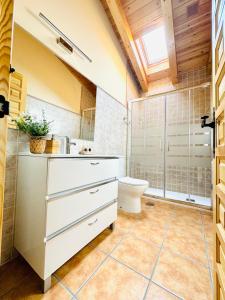 a bathroom with a toilet and a sink at LA PORTADA DE ABAJO in Gallegos