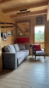 a bedroom with a bed and a bench in a room at Domek góralski Cudna izba in Witów