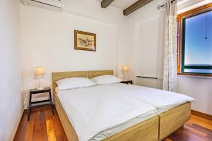 Posteľ alebo postele v izbe v ubytovaní Holiday home Mely