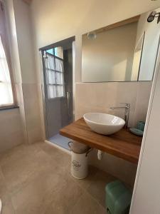 a bathroom with a sink and a shower at Elisabetta1 Guesthouse Sassari in Sassari +23 photos