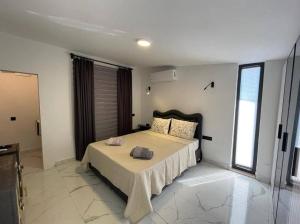 a bedroom with a large bed in a room at Belek Tatil Villa in Belek +17 photos