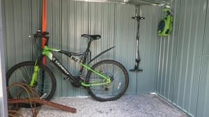 a bike is parked in a garage at Le Black Dog Pub in Saint-Aignan