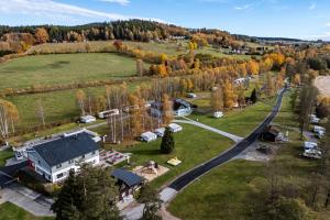 an aerial view of a farm with a house and trees at Penzion DaJa in Horní Planá