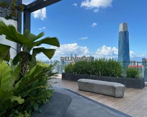 a bench on the roof of a building at Continew Residensi 2bedroom for 5pax with TRX View in Kuala Lumpur