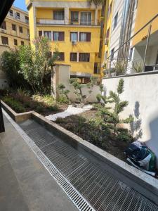 a grate in the ground next to a building at Canova Hotel in Milan