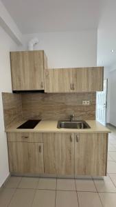 Kuchyň nebo kuchyňský kout v ubytování Enelia Apartments