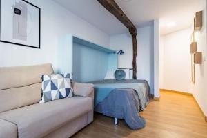 Ένα ή περισσότερα κρεβάτια σε δωμάτιο στο Acogedor apartamento céntrico