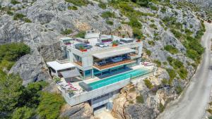 an aerial view of a house on a cliff at Rock Villa in Pollença