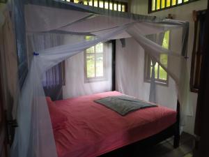 Llit o llits en una habitació de Villa Watumita Sikka