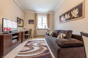 Televízia a/alebo spoločenská miestnosť v ubytovaní P&O Apartments Freta