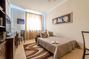 Televízia a/alebo spoločenská miestnosť v ubytovaní P&O Apartments Freta + 9 fotografií