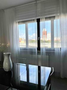 a glass table in a room with a window at Sun-kissed seaside retreat: your Pescara getaway in Pescara
