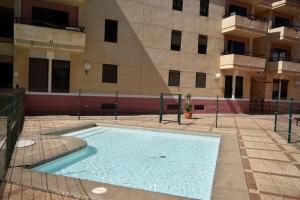 Piscina en o cerca de Apartamento con piscina Arinaga Playa