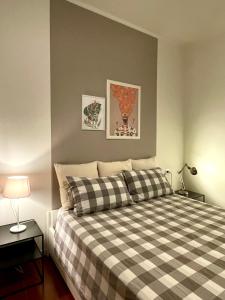 Säng eller sängar i ett rum på La Casa di Simo Appartamento con terrazzo