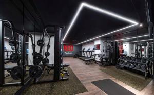 a gym with a bunch of equipment in a room at Radisson RED Tbilisi in Tbilisi City