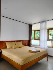 Tempat tidur dalam kamar di Villa Redemptorist