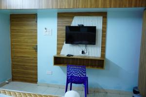 TV a/nebo společenská místnost v ubytování Park View Residency