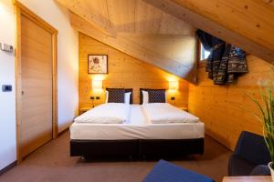 Postel nebo postele na pokoji v ubytování Hotel Cardo