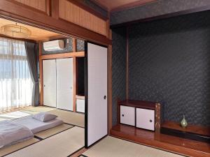 Un pat sau paturi într-o cameră la Maria Hotel 宇都宮