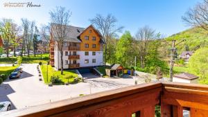 a view from the balcony of a house at Wonder Home - Apartamenty z balkonami Leśny Dom II - w cichej i zielonej części Karpacza in Karpacz