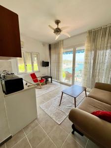 a living room with a couch and a table at MEK HARBOUR view in Fethiye