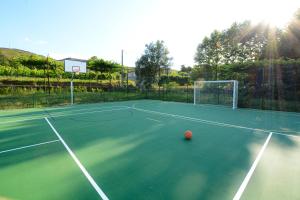 a tennis court with a ball on top of it at Quinta do Fundo in Mondim de Basto