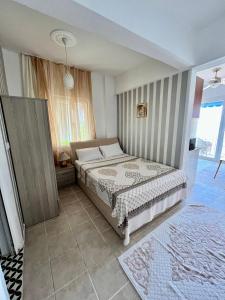 a bedroom with a bed and a large window at MEK HARBOUR view in Fethiye