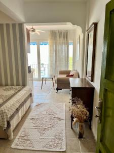 a bedroom with a bed and a living room at MEK HARBOUR view in Fethiye