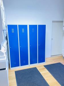 a row of blue lockers in a hospital room at Space Home Apartment - Downtown in Vienna