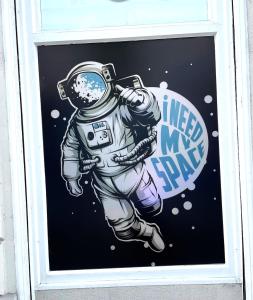 a window with an astronaut painted on it at Space Home Apartment - Downtown in Vienna