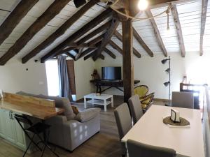 a living room with a table and a couch at Casas Piedra in Arredondo