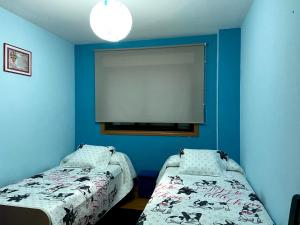 Posteľ alebo postele v izbe v ubytovaní Altavista Apartment