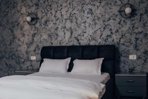 Posteľ alebo postele v izbe v ubytovaní Pensiunea R&R Băilești