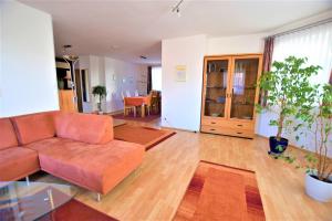 a living room with a couch and a table at Gästehaus Jäger Ferienwohnungen in Gersfeld