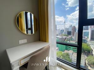 a room with a mirror and a window with a view at *2 Axon Bukit Bintang 3BED 2BATH Luxury Suites in Kuala Lumpur