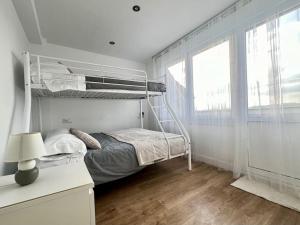 Двухъярусная кровать или двухъярусные кровати в номере Öspede Clea Carballo Costa da Morte