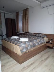 Postel nebo postele na pokoji v ubytování Aqua Apartments 2