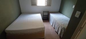 Postel nebo postele na pokoji v ubytování Casa próxima ao centro de Caraguatatuba