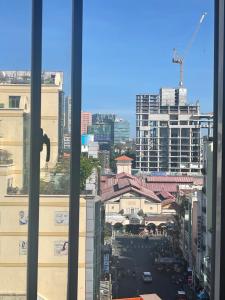 a view of a city street from a window at Rosa May Hotel in Ho Chi Minh City