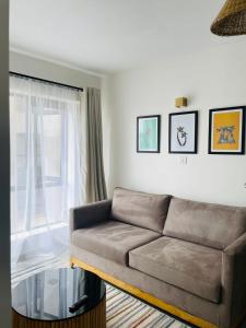Posezení v ubytování vibes by T one bedroom apartment in Rongai with a pool