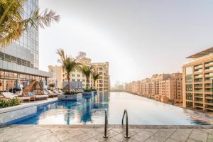 a view of a canal in a city with buildings at Splendor 1BR with Breathtaking Palm Views in Dubai
